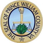 The seal of Prince William County, VA, features a hand holding balanced scales above a green plant, with a blue background and gold border displaying the text THE SEAL OF PRINCE WILLIAM COUNTY, VA.